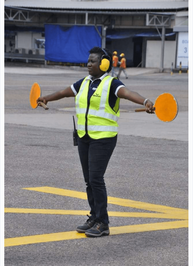 Ghana's first female aircraft marshaller, Madam Felicia